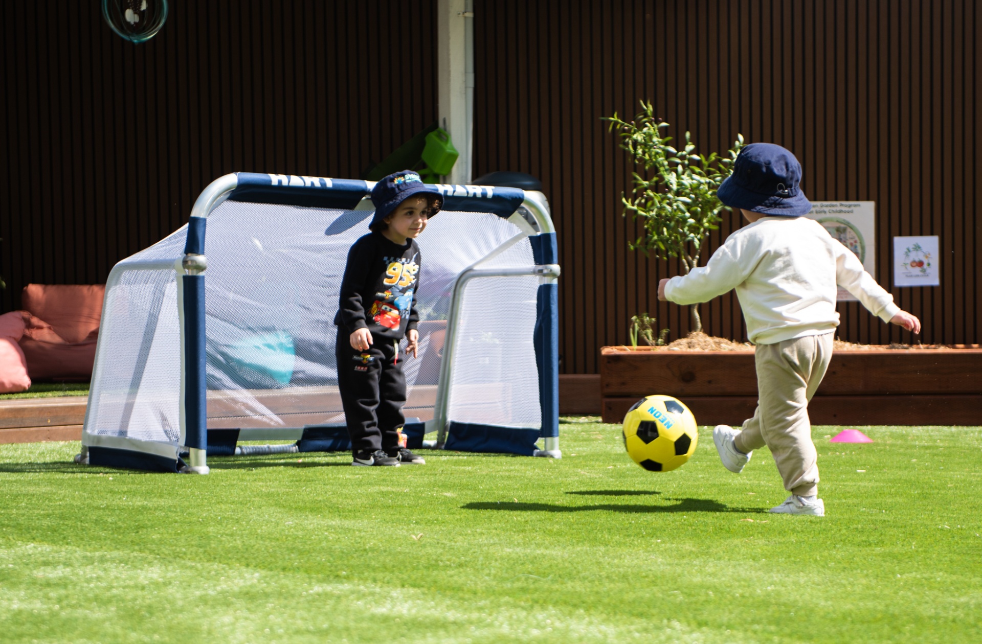 Children playing soccer outdoors